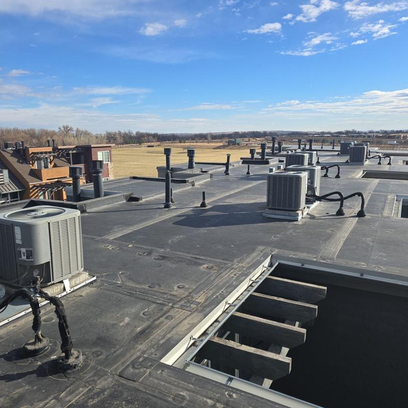 Flat roof with HVAC units and ventilation pipes Flat roof with HVAC units and ventilation pipes