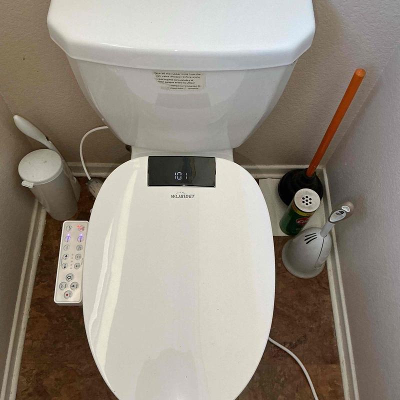 Toilet bidet seat with control panel installed