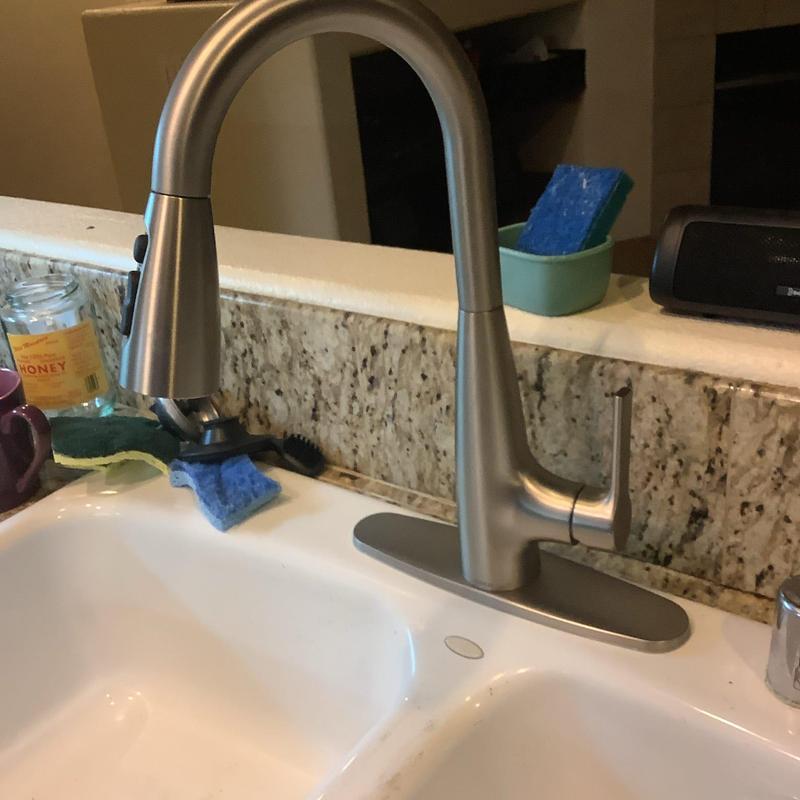 Kitchen faucet with spray head installed in sink