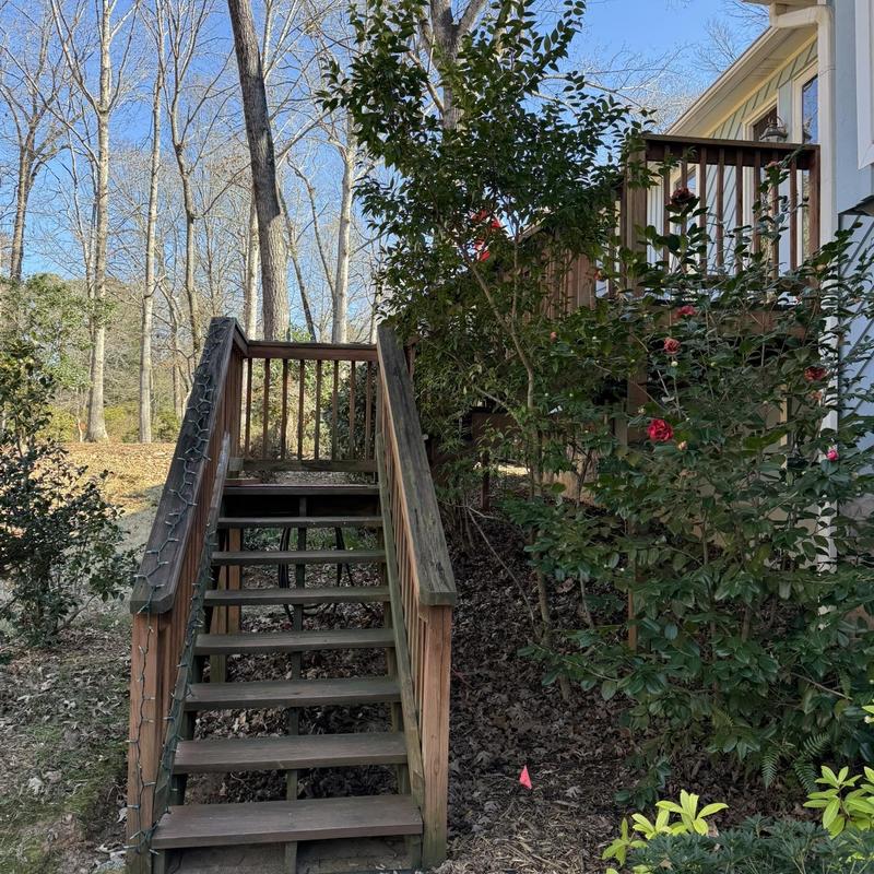 Wooden stair stringers and handrails with metal balusters