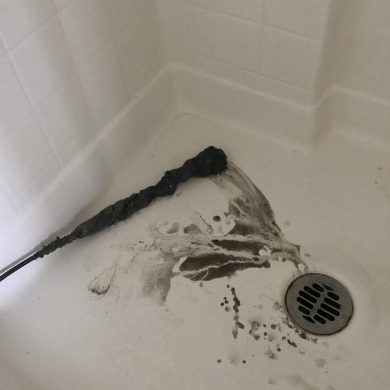 Shower drain clog removed with drain snake tool