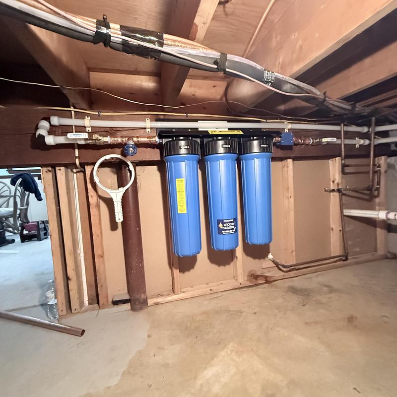 Water filter system installation in basement wall Water filter system installation in basement wall