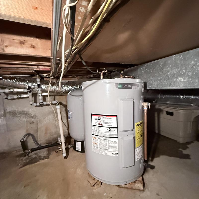 Water heater installation in basement utility area Water heater installation in basement utility area