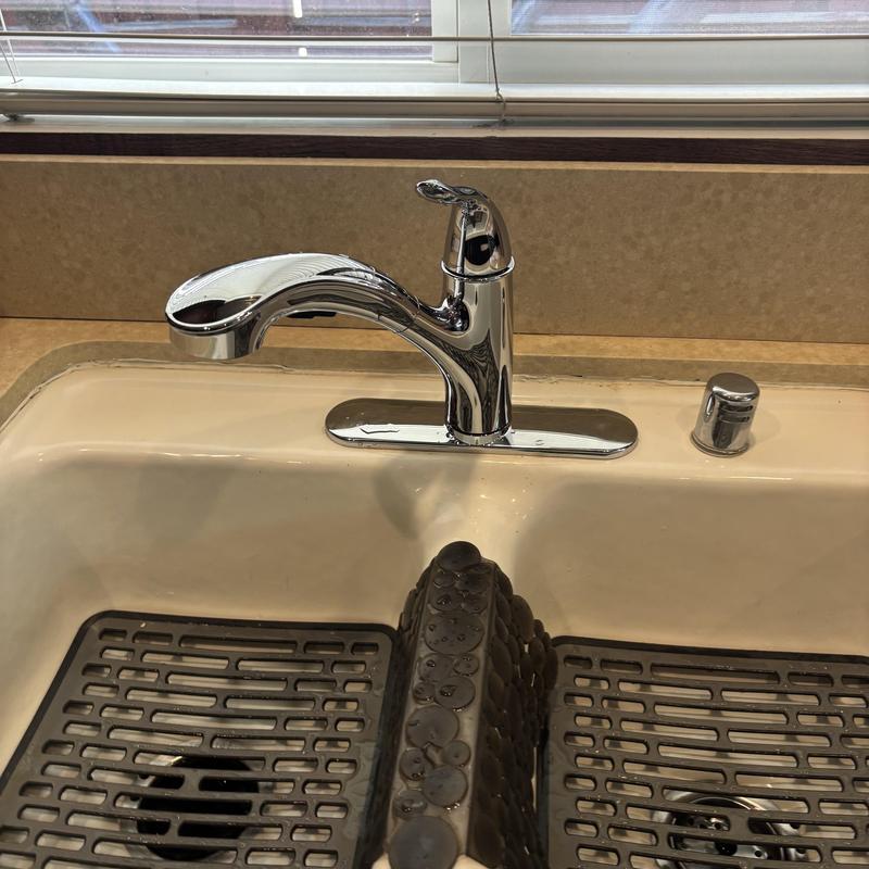 Kitchen faucet installation with sink drain and mat