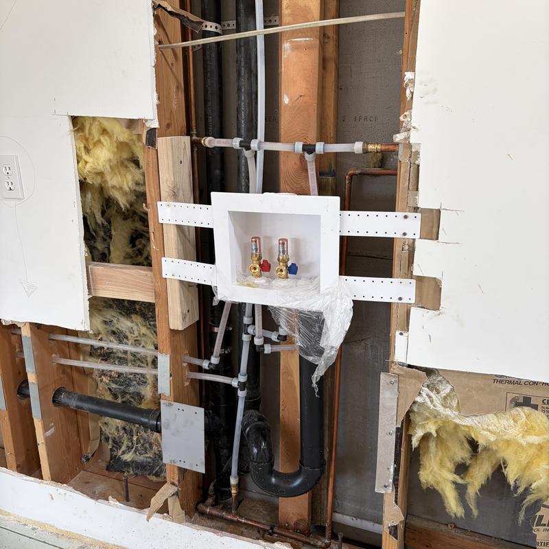 Washer box and drain pipe installation in wall cavity