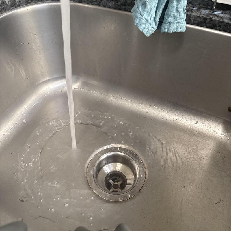 Kitchen sink drain clearing and water flow test