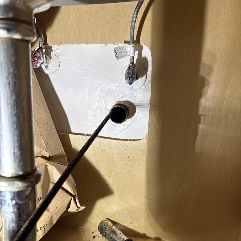 Kitchen drain line clearing with Super-Vee machine