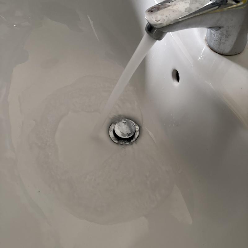 Basin drain with running water testing proper flow