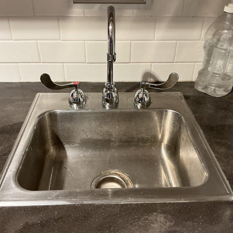 Commercial kitchen faucet with sink and lever handles