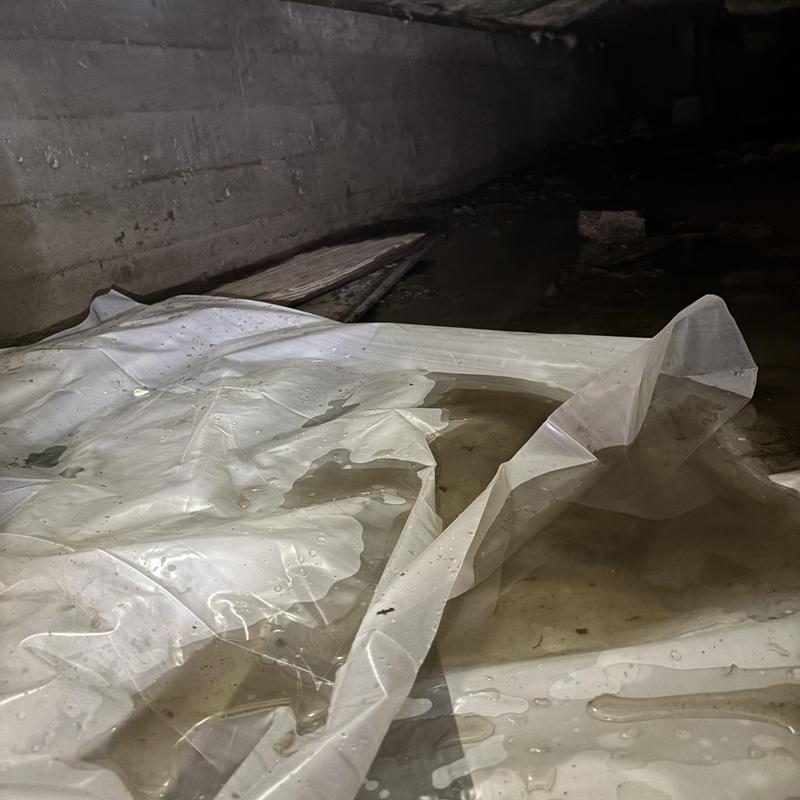 Water leak under crawl space plastic liner in crawl space