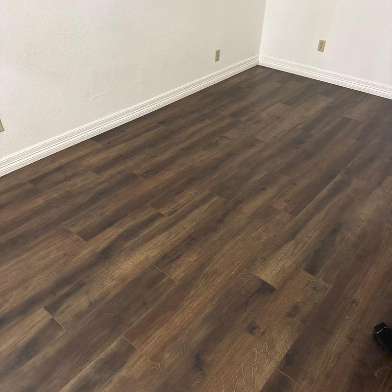 LVP flooring with new baseboards in McKinney room
