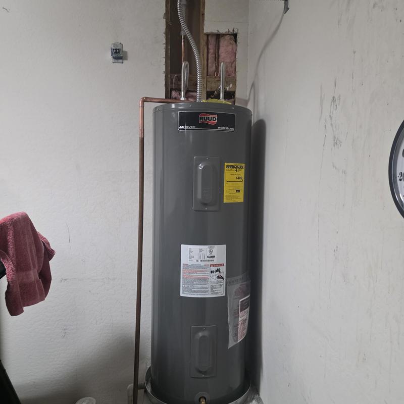 Electric water heater with exposed leaking pex pipe