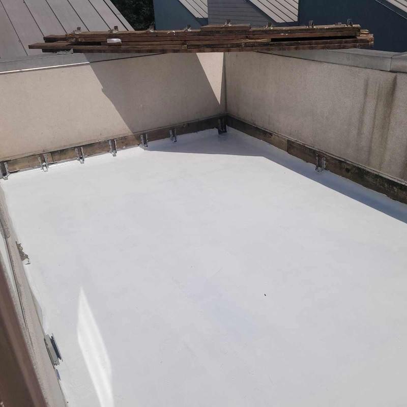 Flat roof silicone sealant on townhome deck boards