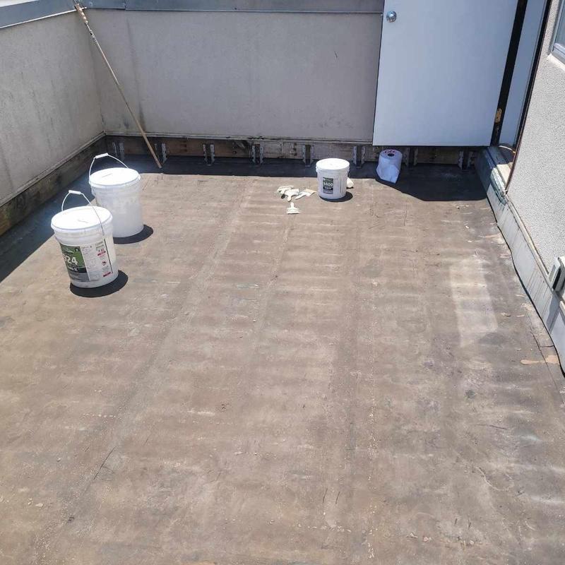Flat roof silicone sealant with deck board prep materials