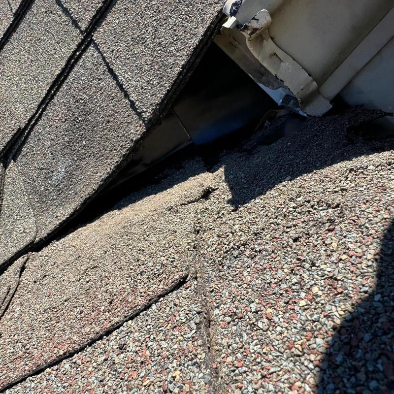 Asphalt shingle roof with valley flashing detail