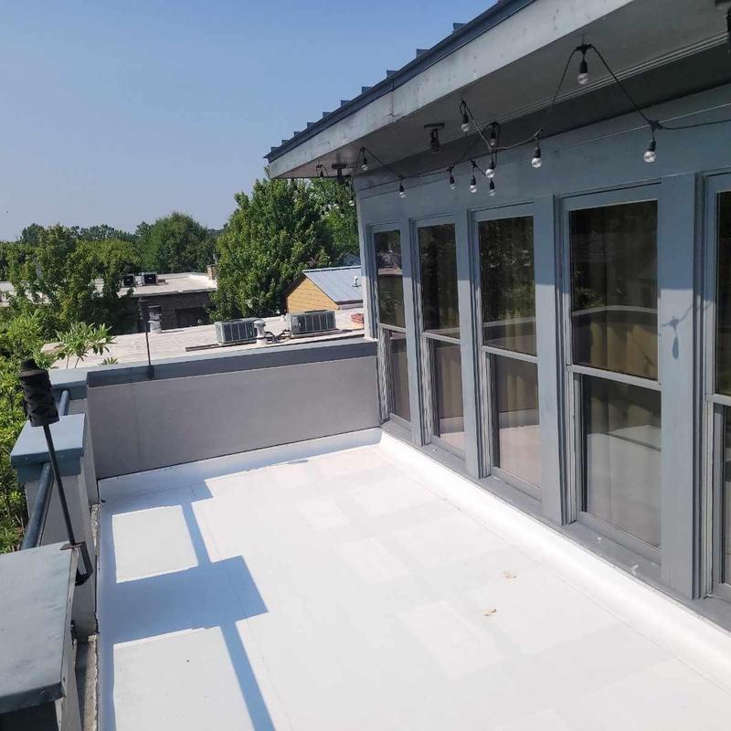 TPO membrane flat roof with balcony windows