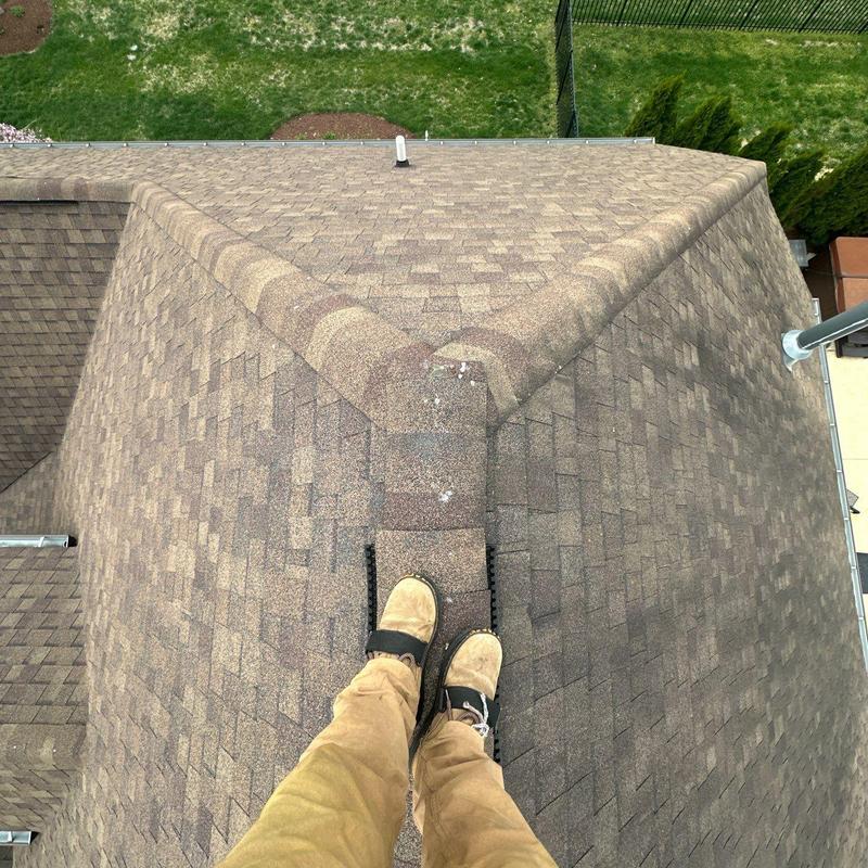 Roof ridge caps with hail damage and shingle wear