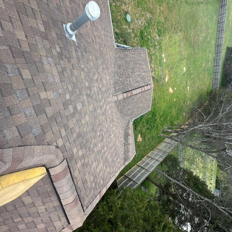 Shingle roof with vent pipe and ridge cap inspection