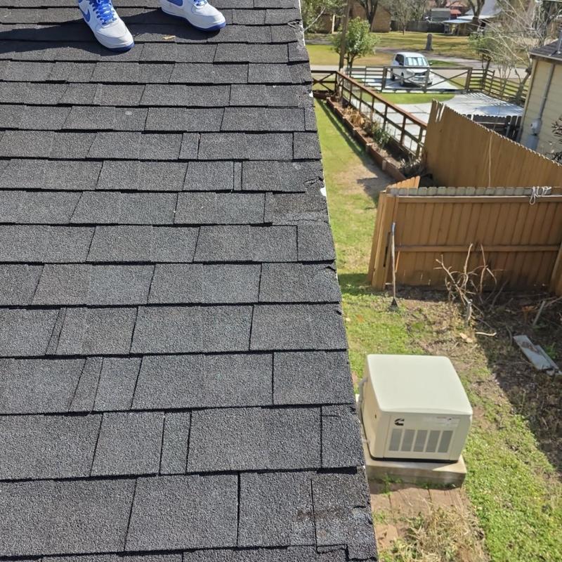 Asphalt shingle roof with visible hail damage inspection