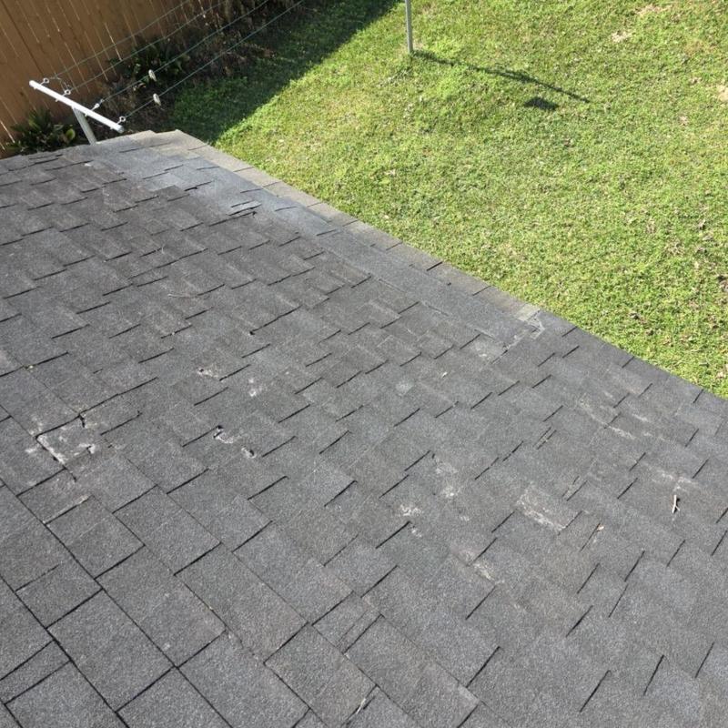 Asphalt shingle roof with visible hail damage