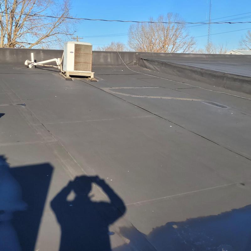 EPDM rubber roof with HVAC unit on flat surface