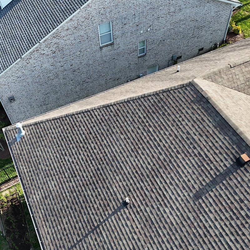 Asphalt shingle roof with hail damage inspection