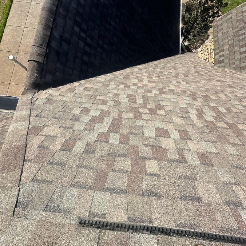 Asphalt shingle roof with hail damage inspection