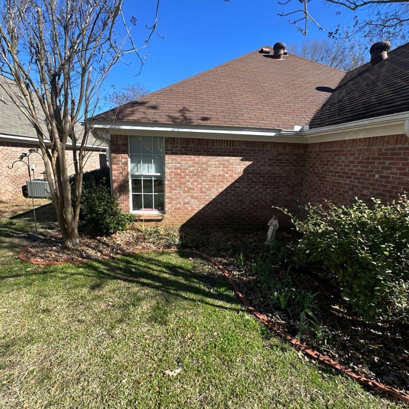 Roof shingles inspection on brick house exterior Roof shingles inspection on brick house exterior