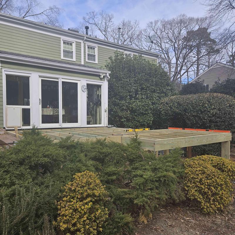 Deck framing with level tools during construction Deck framing with level tools during construction