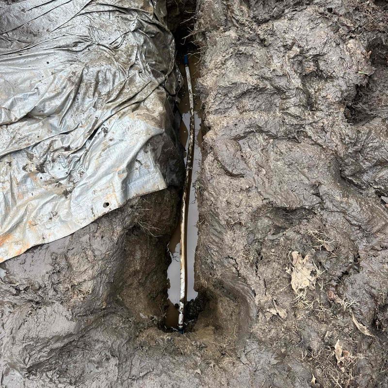 Underground water pipe trench with muddy excavation Underground water pipe trench with muddy excavation