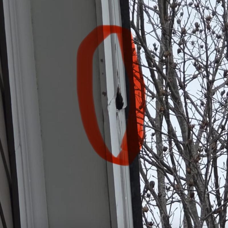 Rotted wood siding with damaged corner flashing