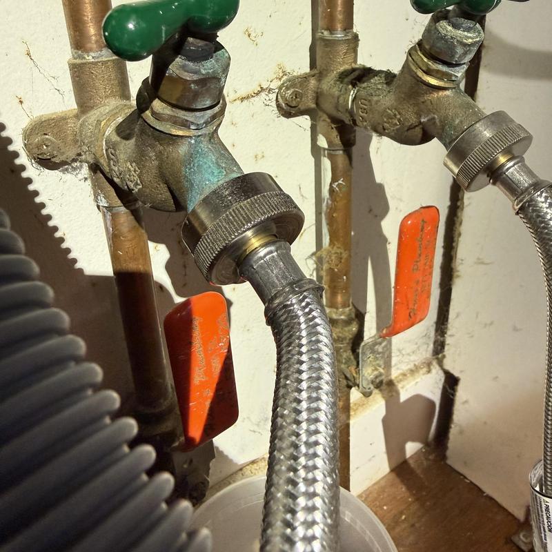 Washing machine braided supply line connected to faucet