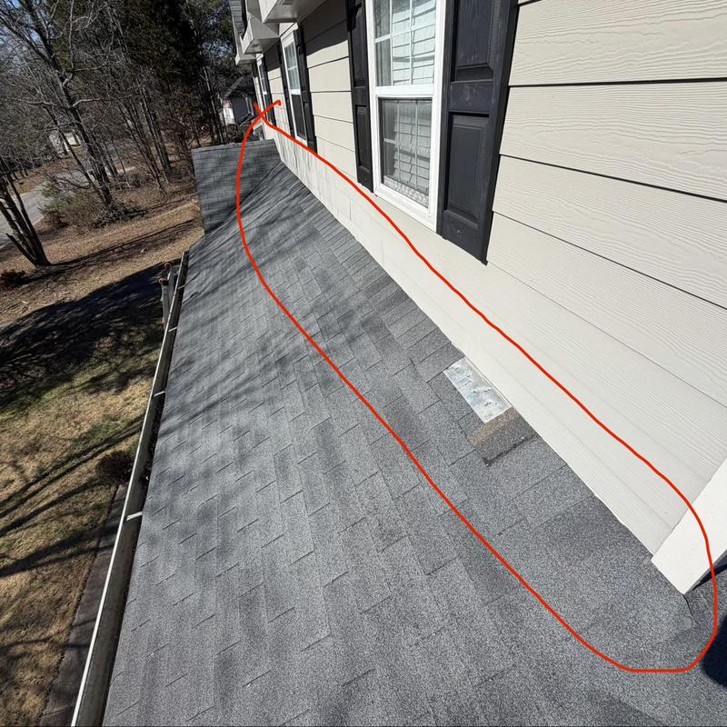 Wall flashing and roof valley on faded slate shingles