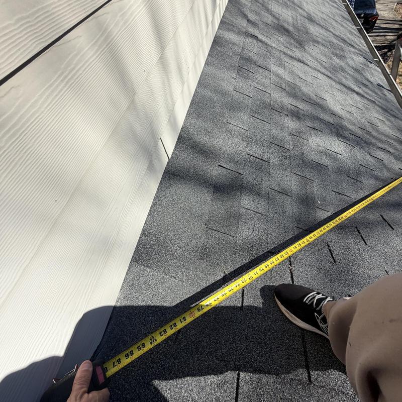 Wall flashing and roof valley inspection with tape measure