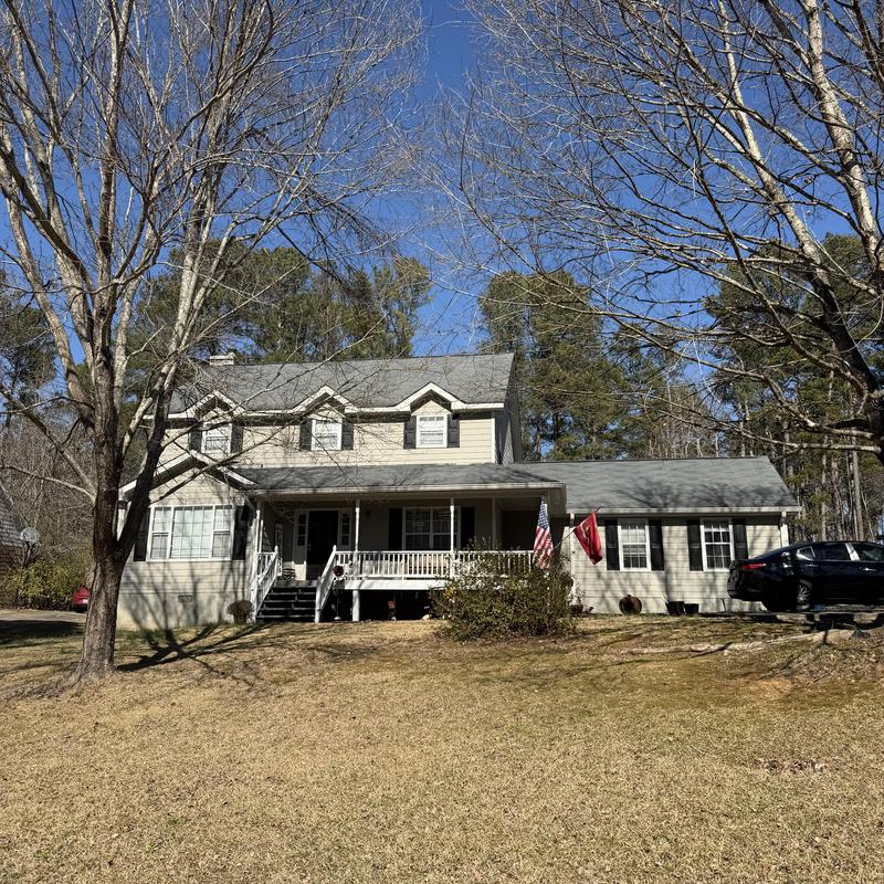Wall flashing and roof valley on two-story house