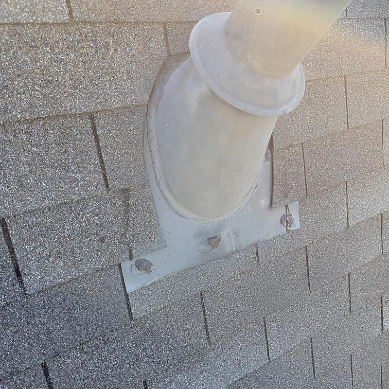 Pipe boot on shingle roof with new caulking