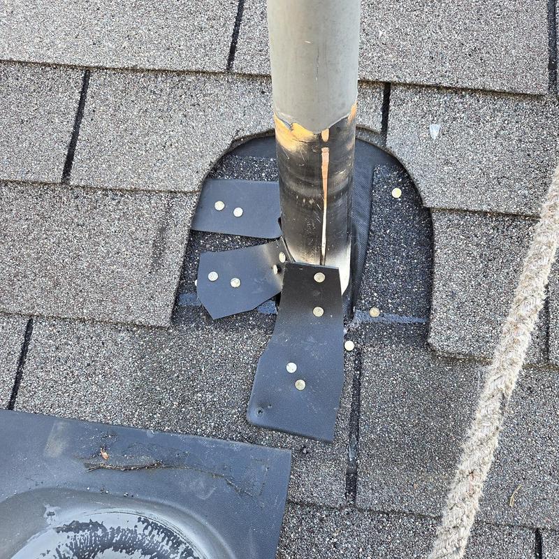 Pipe boot on shingle roof with nails and caulking
