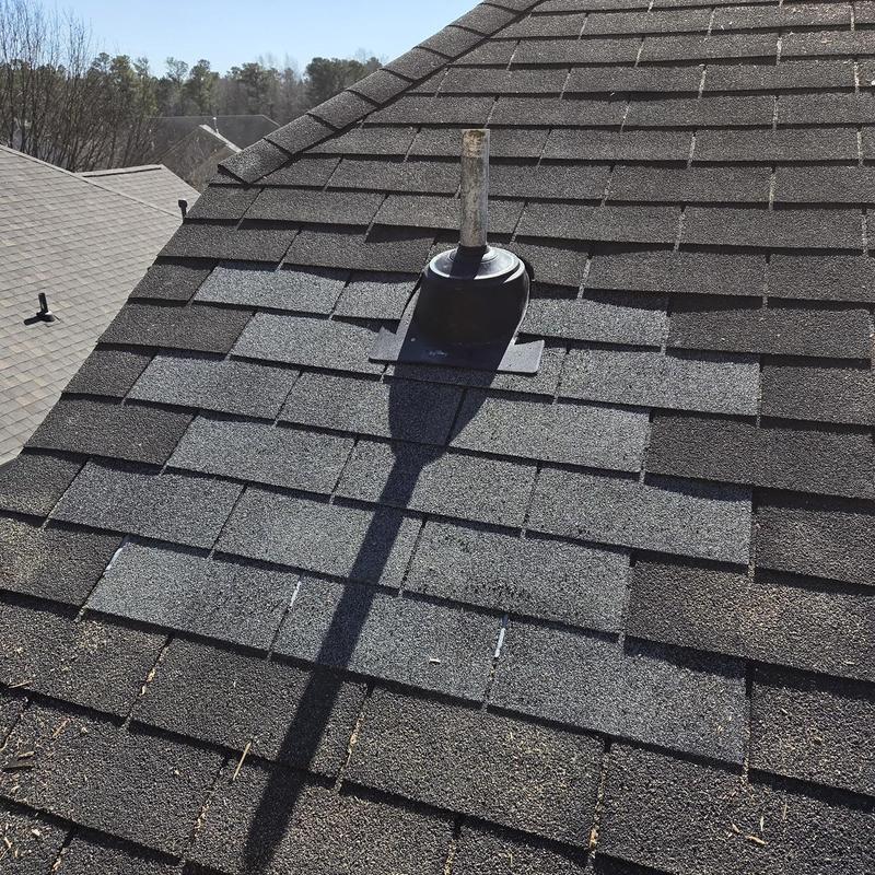 Shingles and pipe boot replacement on roof surface