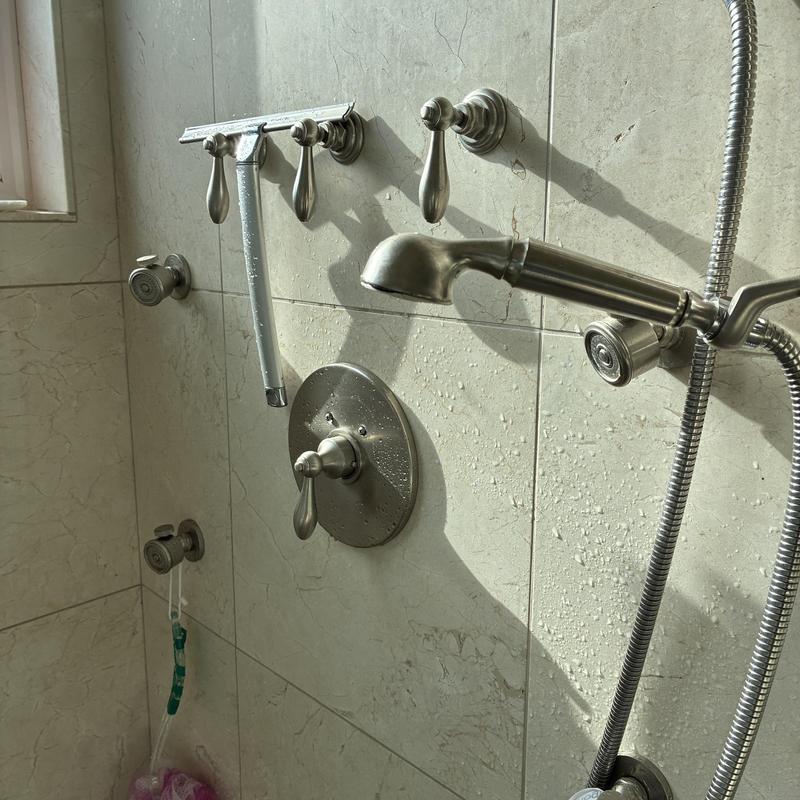Shower handles and fixtures retightened in master bath