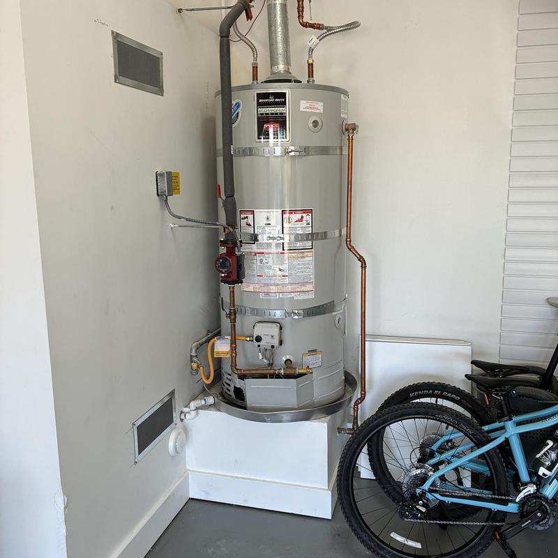 Water heater with new circulation pump installed
