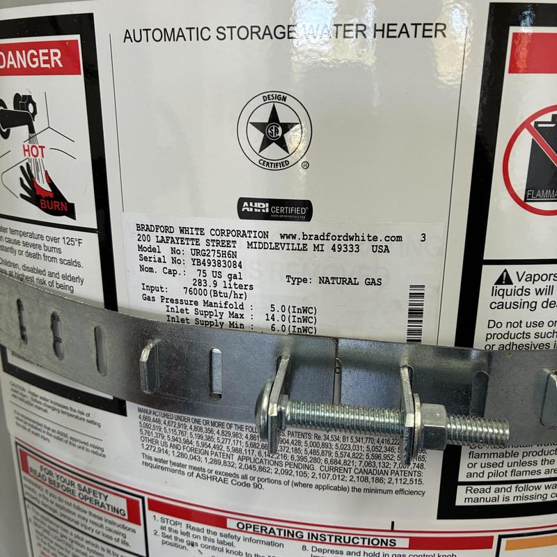 Water heater label showing model and safety info
