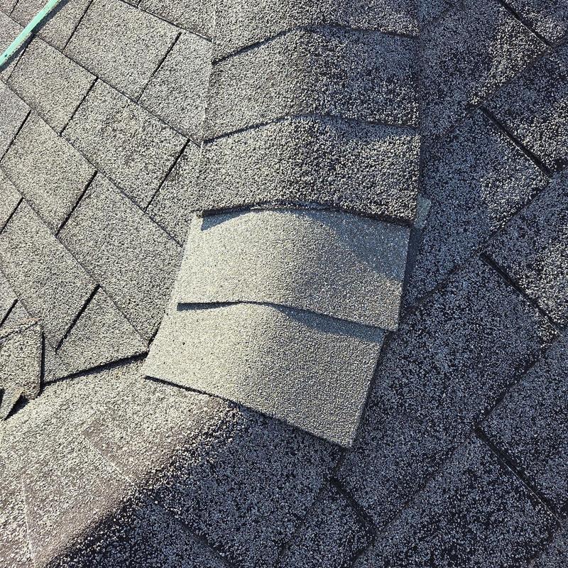 Ridge cap and field shingles on asphalt roof