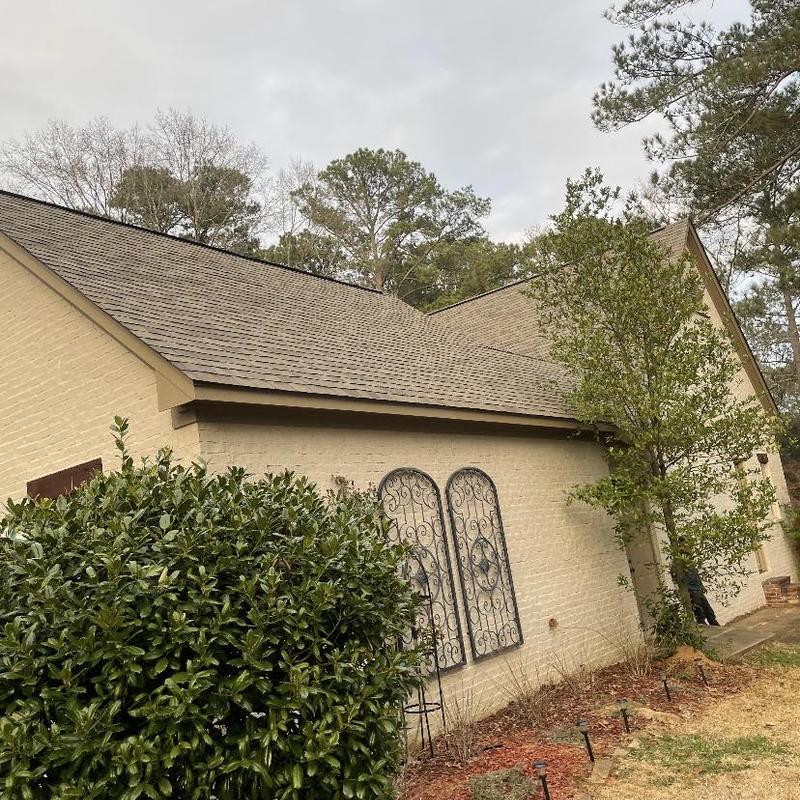 Roof system with new shingles on residential house Roof system with new shingles on residential house