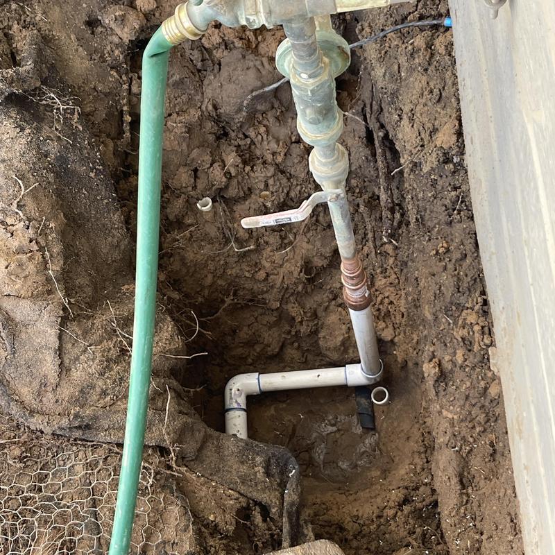 PVC mainline riser with shutoff valve in dirt hole