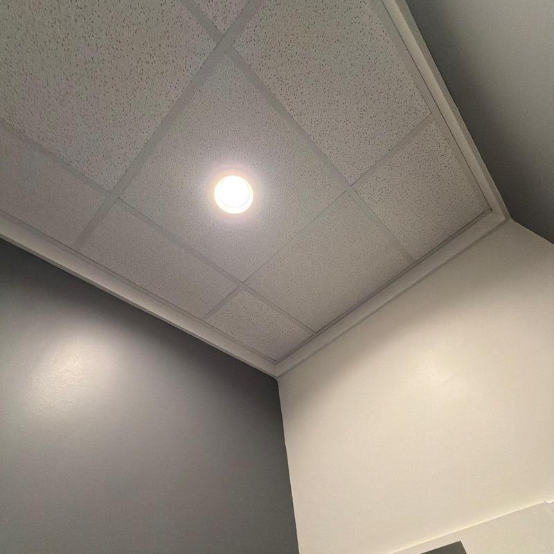 Drop ceiling tiles with recessed lighting fixture