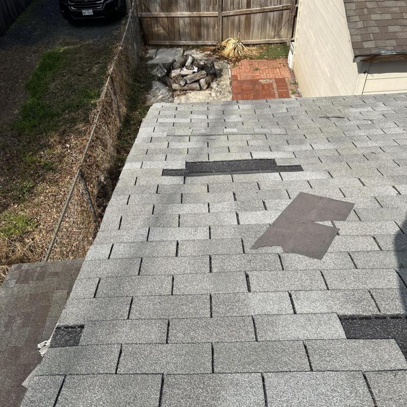 Asphalt shingle roof with patch repairs and missing shingles