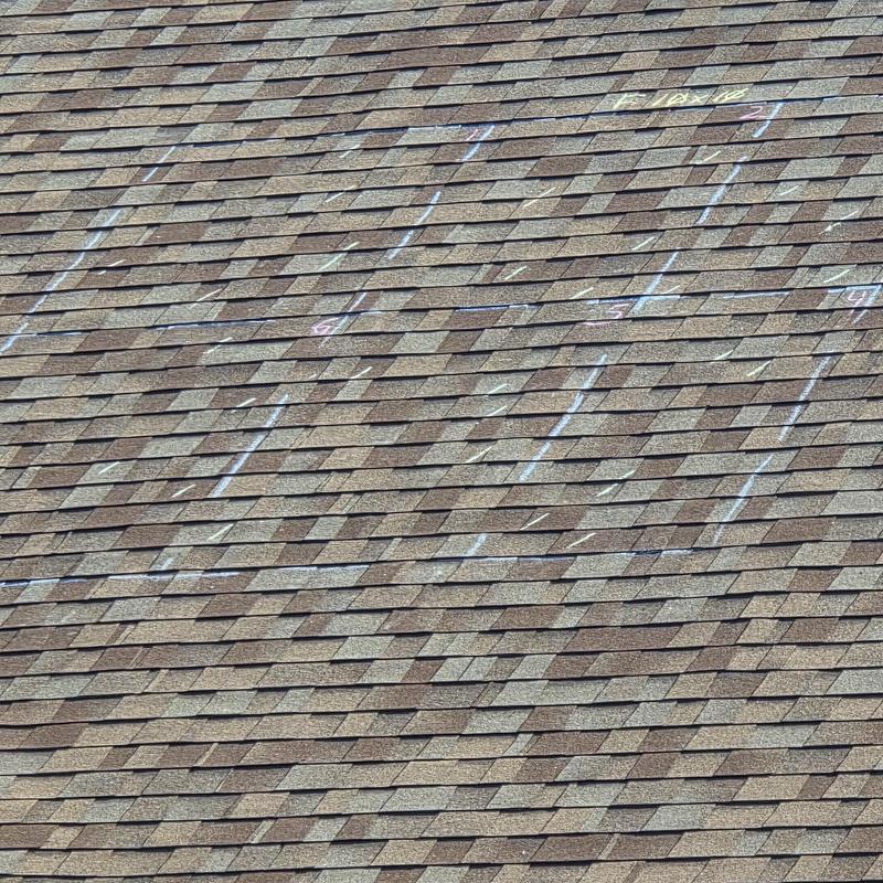 Asphalt shingles with hail damage markings