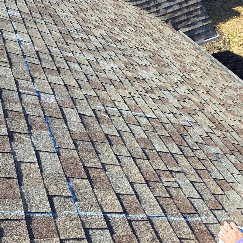 Asphalt shingle roof with hail damage markings