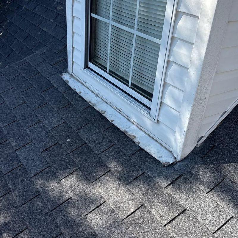 Roof window flashing and asphalt shingle roof inspection