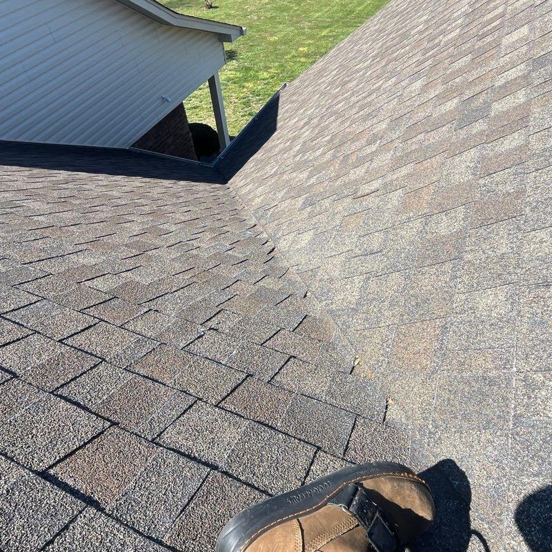 Asphalt shingle roof ridge and valley inspection